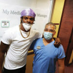 JAYSON-SERRANO-WITH-LAMAR-JACKSON-BALTIMORE-RAVENS